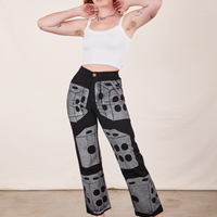 Alex is 5'8" and wearing XS Icon Work Pants in Dice paired with vintage off-white Cropped Cami