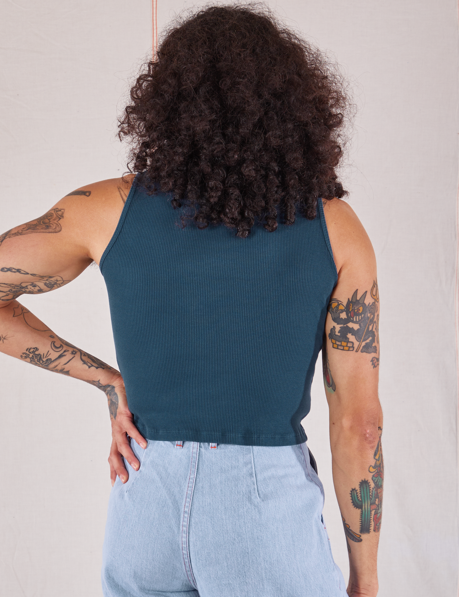 Sleeveless Essential Turtleneck in Lagoon back view on Jesse