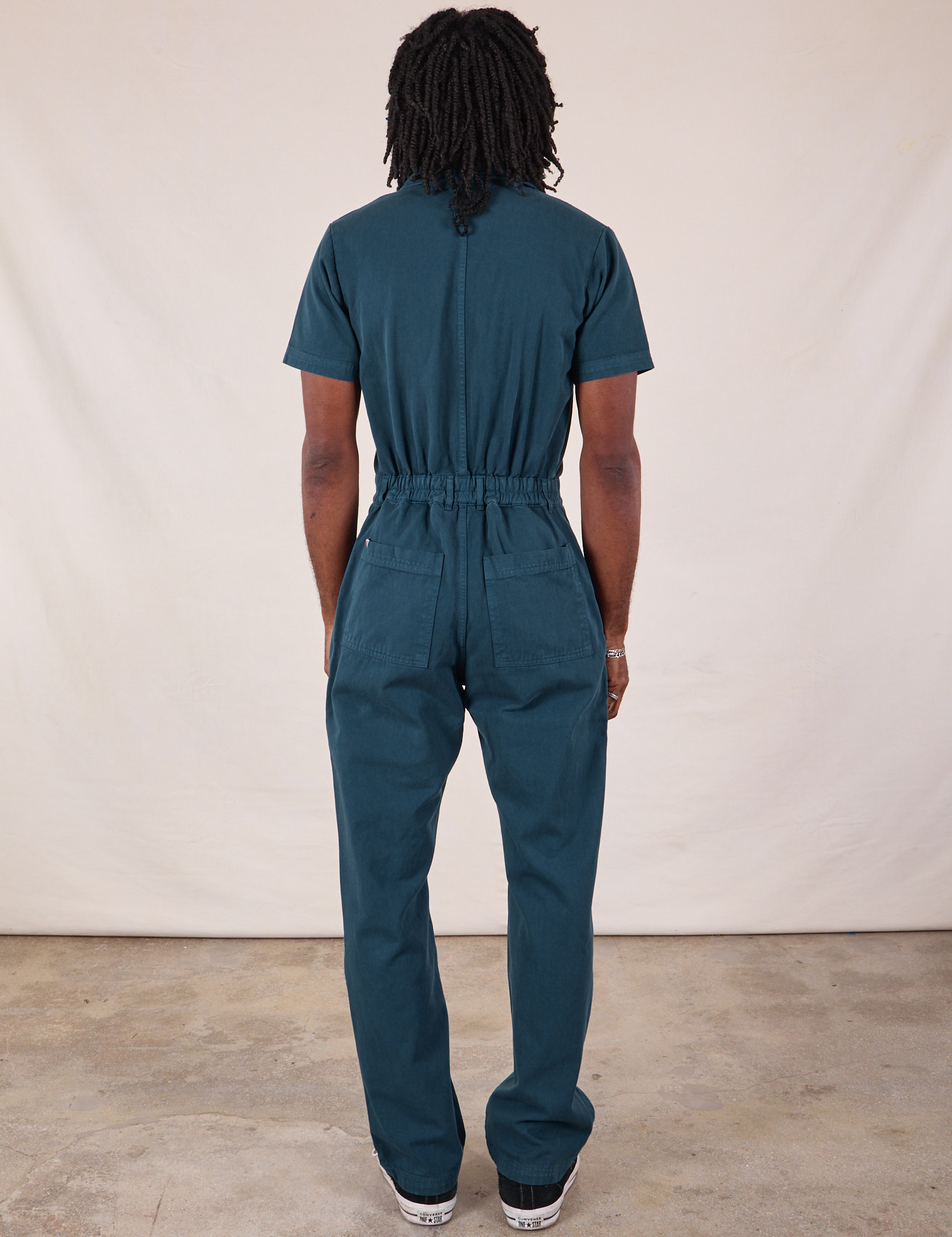 Back view of Long Jumpsuit in Lagoon on Jerrod