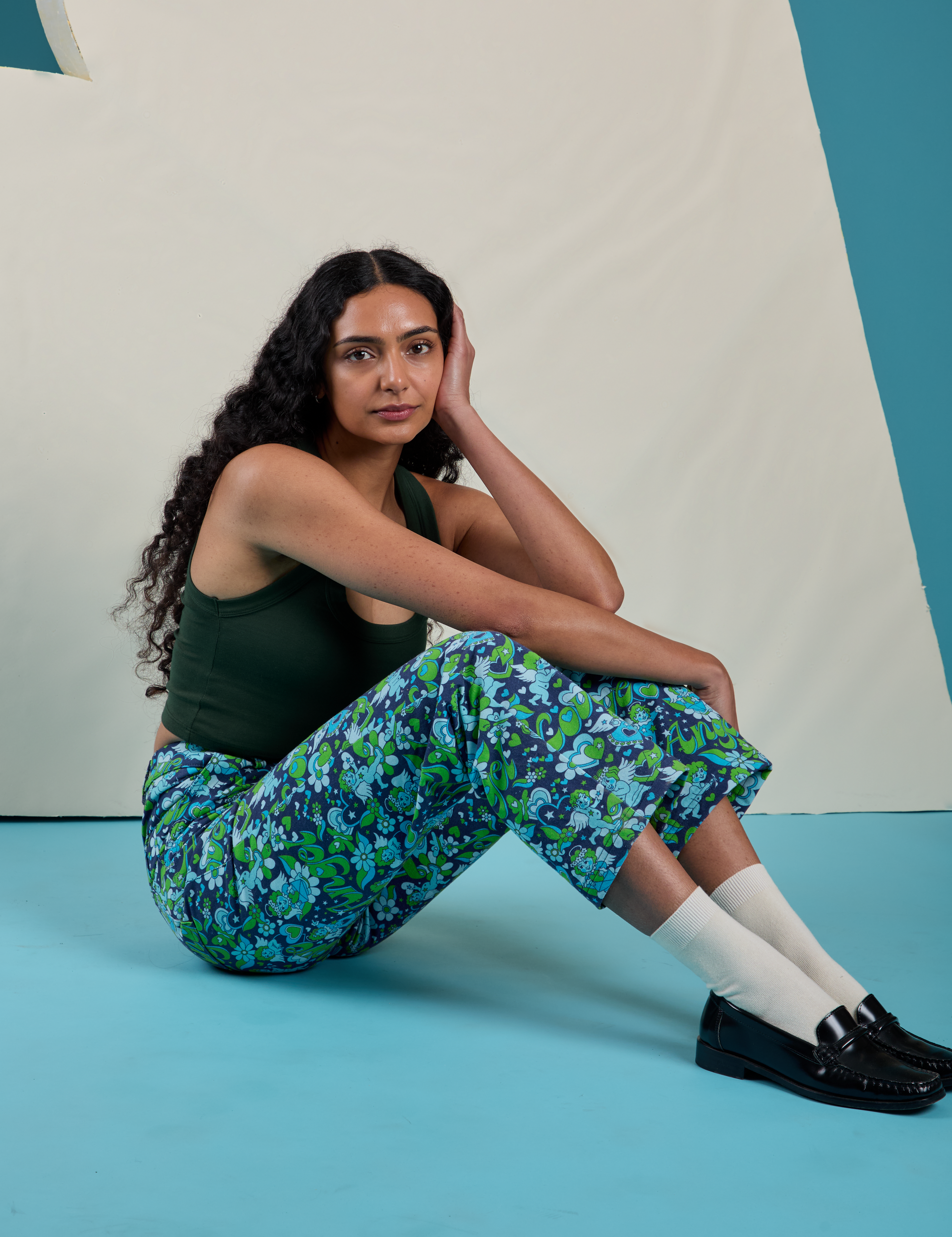 Shahana is wearing Work Pants in Angel Print and swamp green Cropped Tank