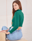 Essential Turtleneck in Hunter Green angled back view on Scarlett