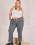 Juliet is 5'7" and wearing 2XL Mid-Rise Work Pants in Slate Grey paired with a Cropped Tank in vintage tee off-white