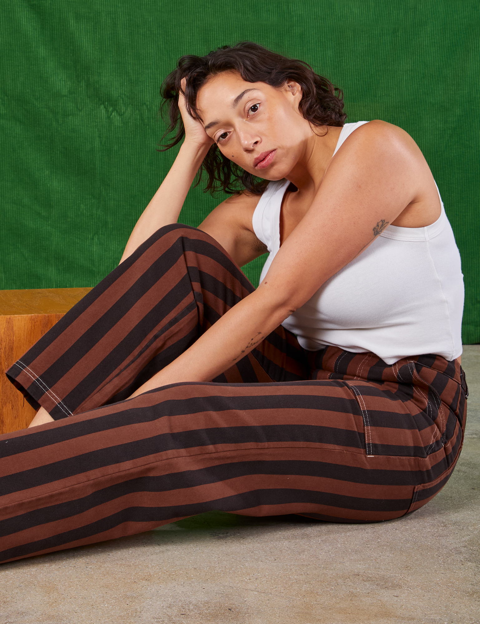 Tiara is wearing Black Stripe Work Pants in Fudgesicle Brown