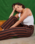 Tiara is wearing Black Stripe Work Pants in Fudgesicle Brown