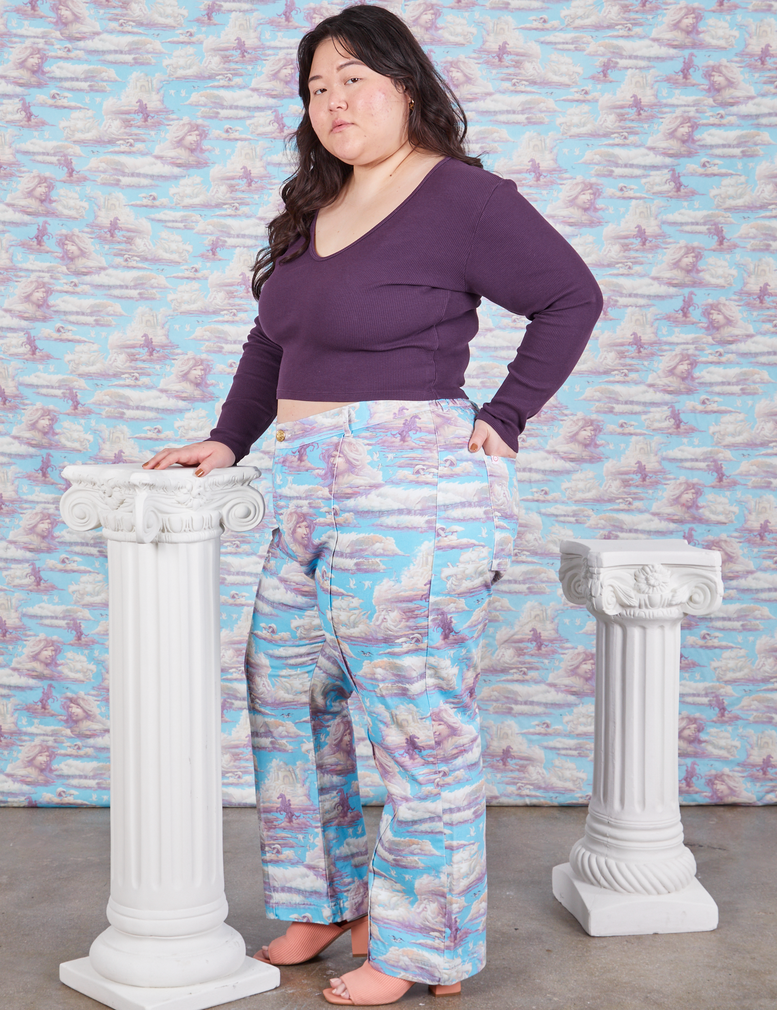 Side view of Western Pants in Cloud Kingdom and nebula Long Sleeve V-Neck Tee on Ashley