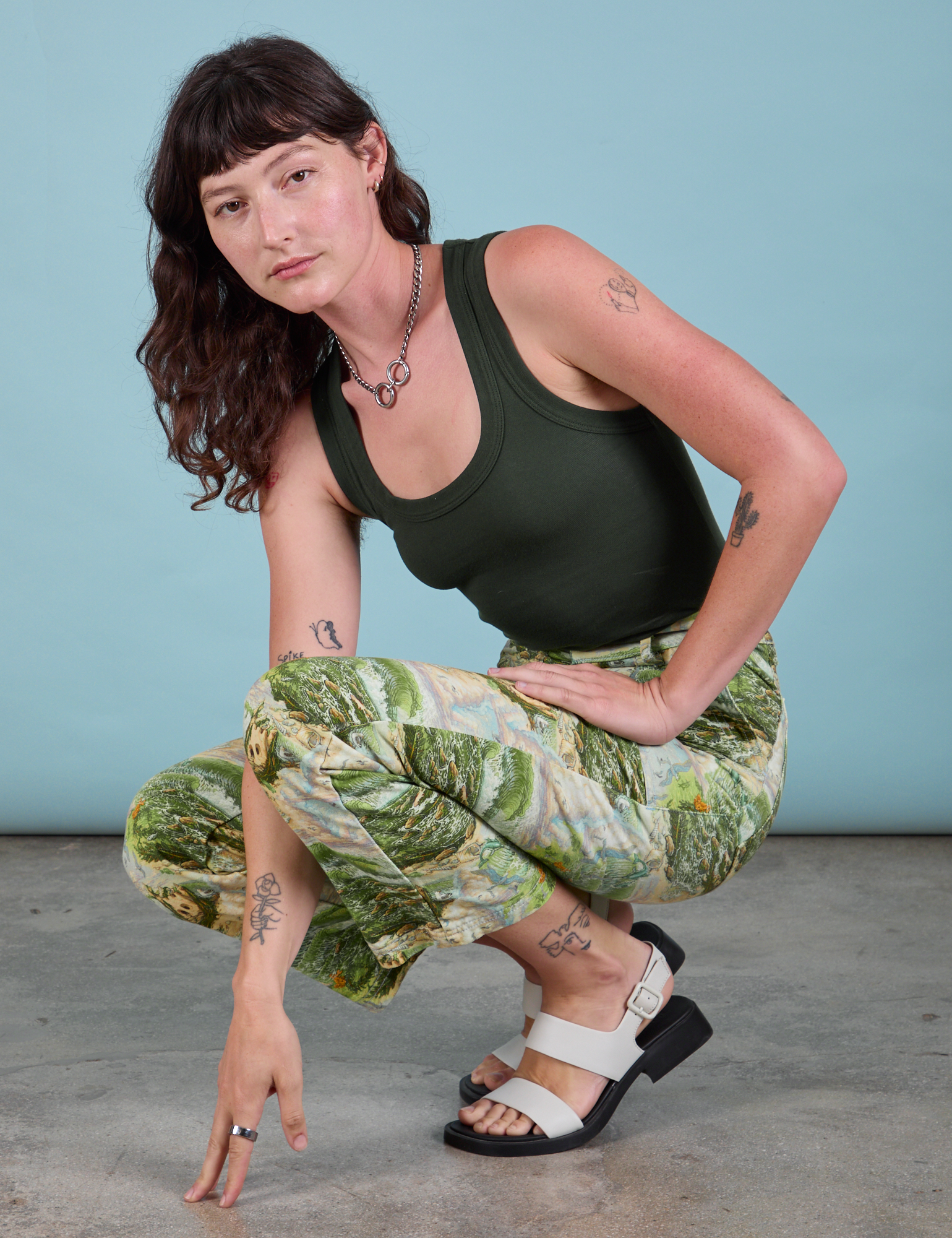 Work Pants in Ocean and Sky and swamp green Tank Top on Alex