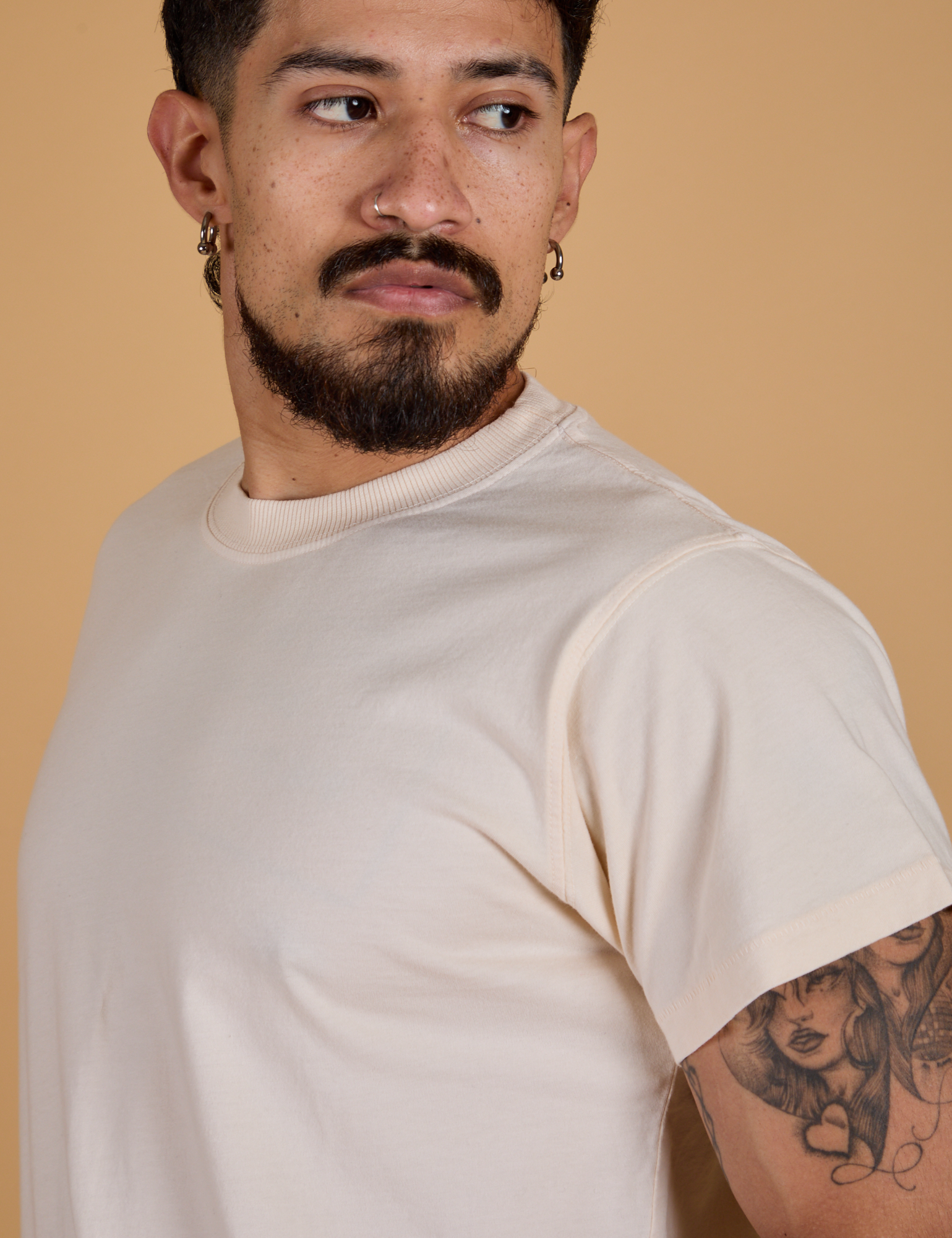 Angled front view close up of Organic Vintage Tee in Vintage Off White on Jesse