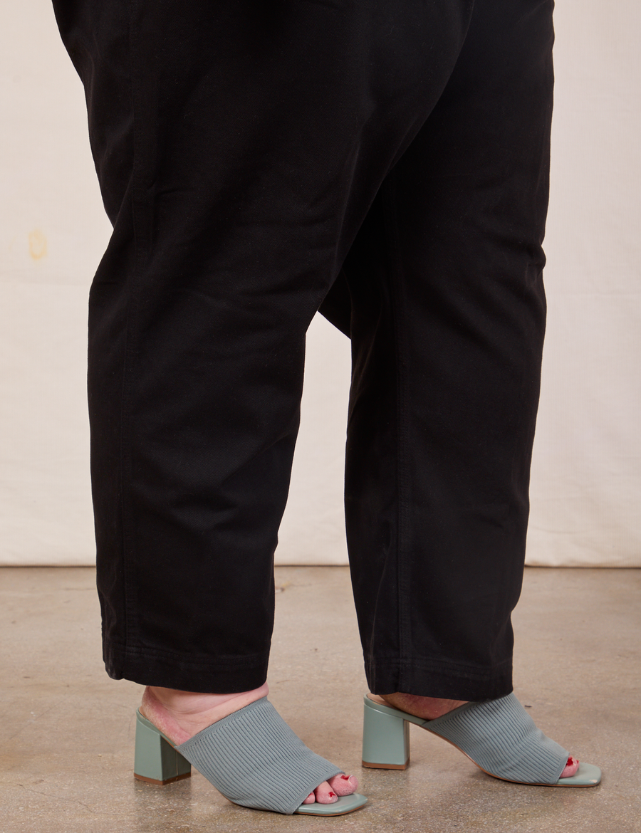 Side view pant leg close up of Original Overalls in Mono Black on Catie