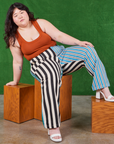 Ashley is wearing Mismatched Stripe Work Pants and burnt terracotta Cropped Tank Top