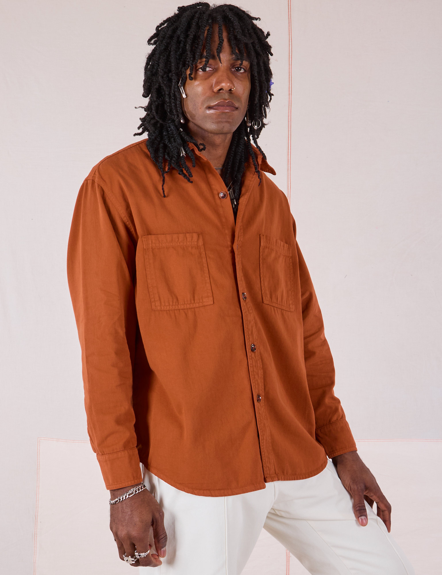 Angled front view of Twill Overshirt in Burnt Terracotta on Jerrod