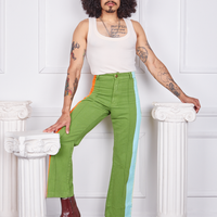 Jesse is 5'8" and wearing XS Hand-Painted Stripe Western Pants in Bright Olive paired with a vintage off-white Tank Top