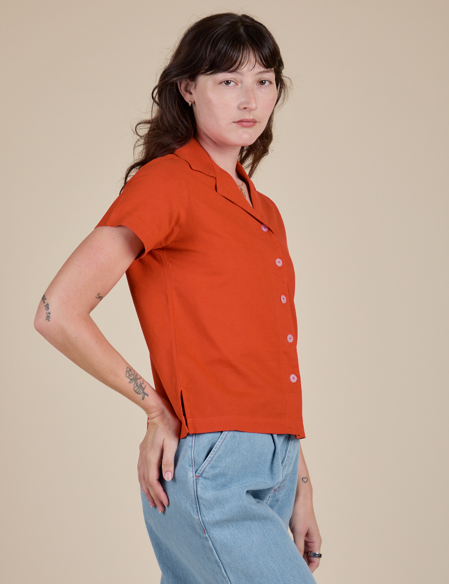 Side view of Pantry Button-Up in Chili Red on Alex