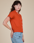 Side view of Pantry Button-Up in Chili Red on Alex