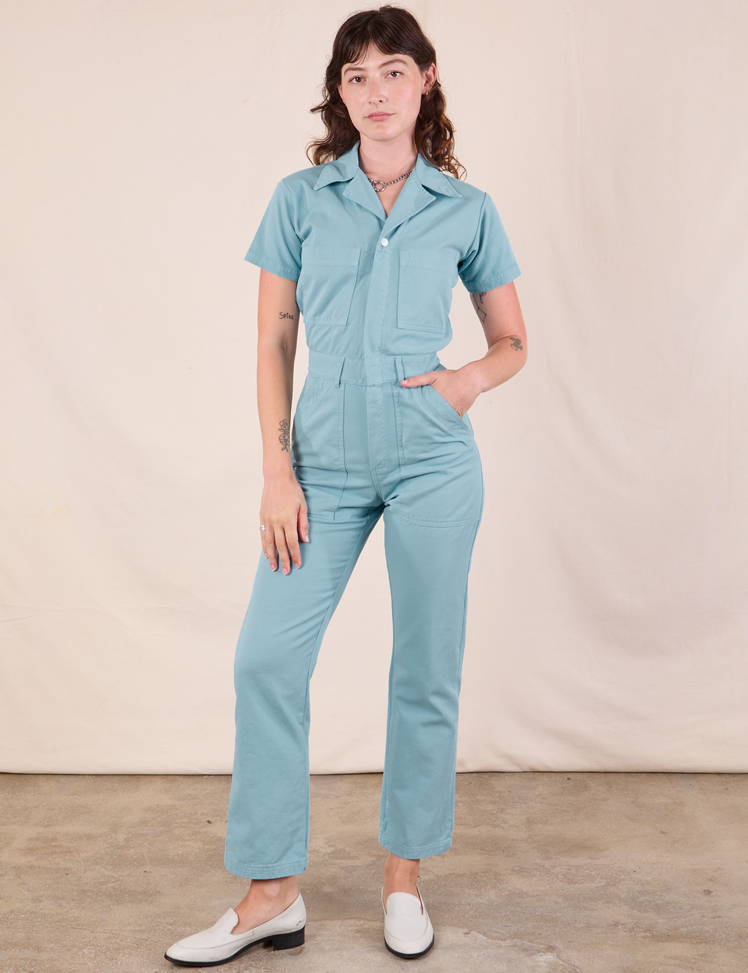 Alex is 5&#39;8&quot; and wearing XXS Short Sleeve Jumpsuit in Baby Blue