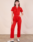 Alex is 5'8" and wearing XXS Short Sleeve Jumpsuit in Mustang Red