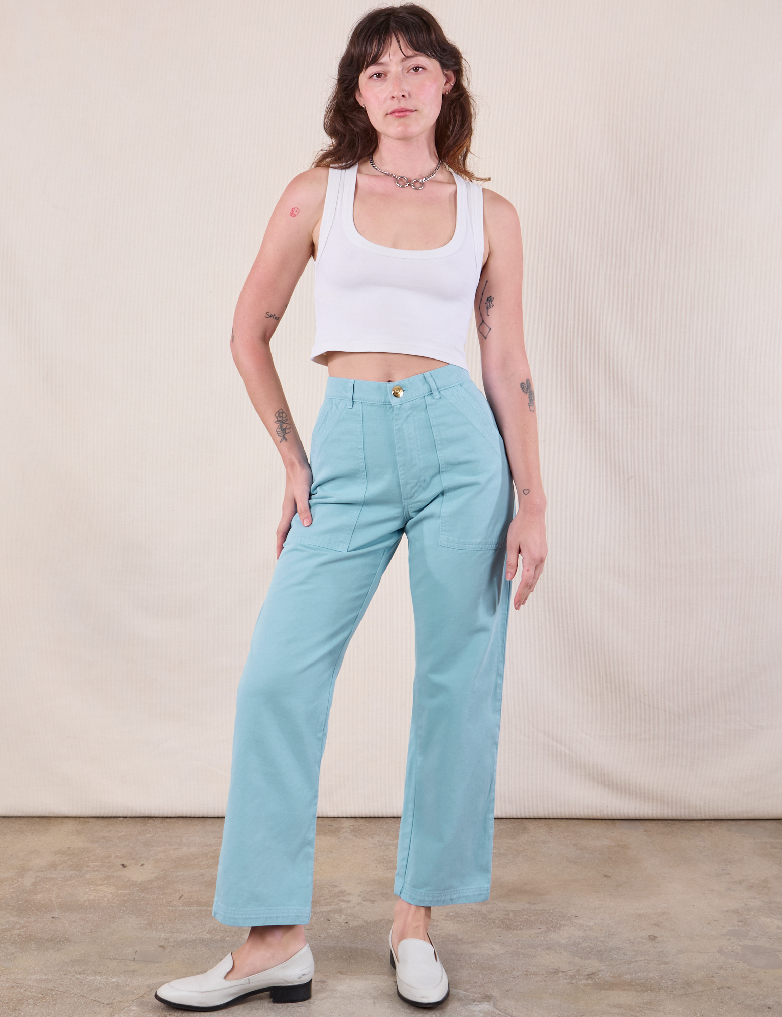 Alex is 5&#39;8&quot; and wearing XXS  Work Pants in Baby Blue paired with a Cropped Tank in Vintage Tee Off-White