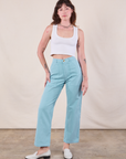 Alex is 5'8" and wearing XXS  Work Pants in Baby Blue paired with a Cropped Tank in Vintage Tee Off-White