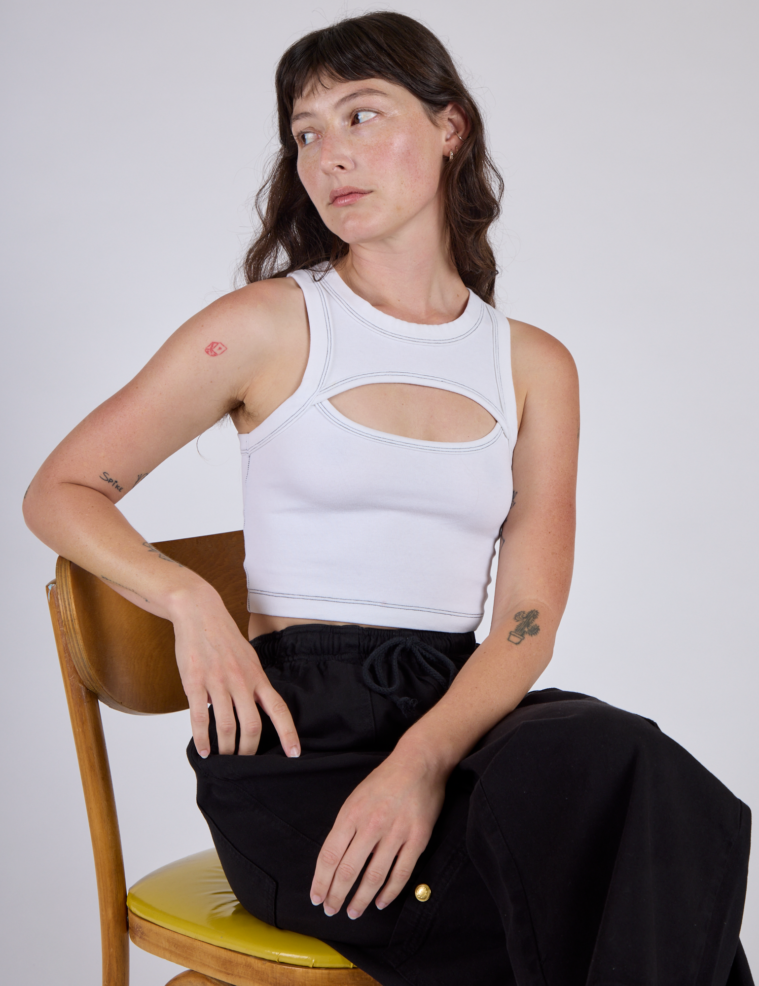 Alex is wearing the Vintage Tee White Porthole Tank