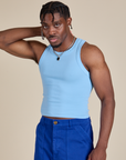 Racerback Tank in Baby Blue angled front view on Isaac