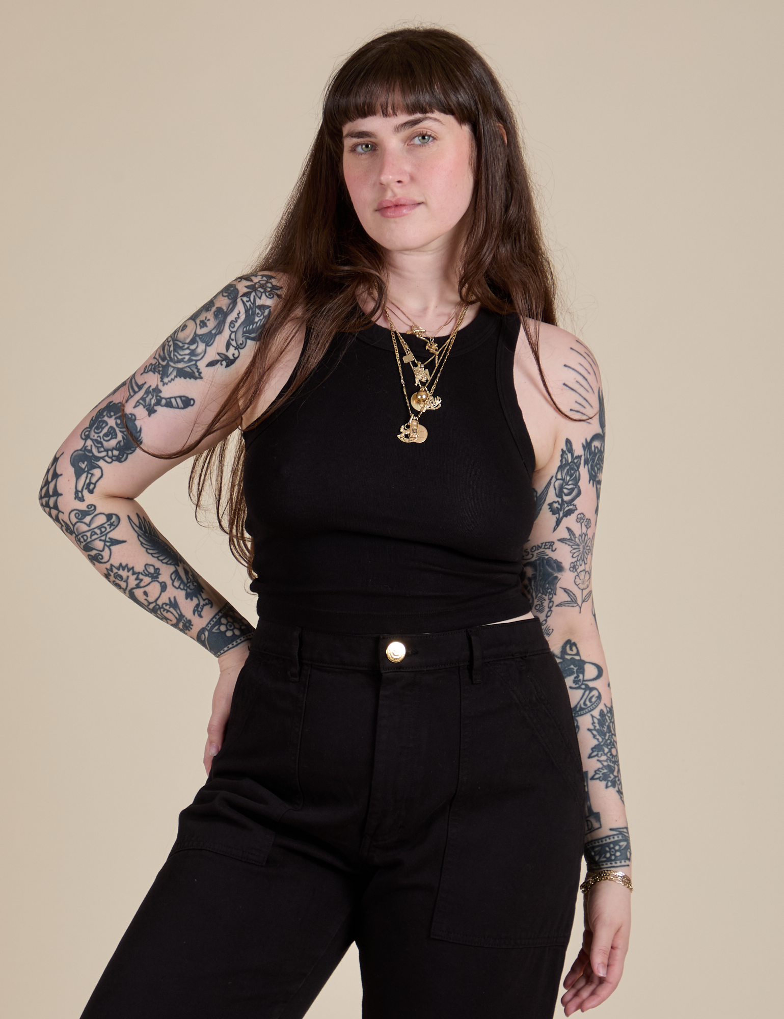 Sydney is 5’9” and wearing XXS Racerback Tank in Black