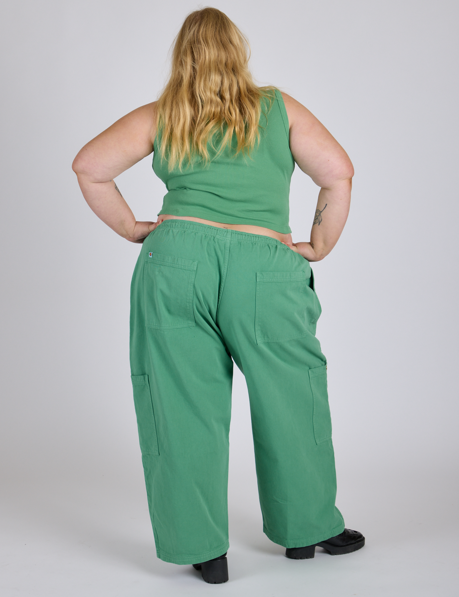 Back view of Drop Pocket Cargo Pants in Seafoam Green and matching Muscle Tee on Juliet