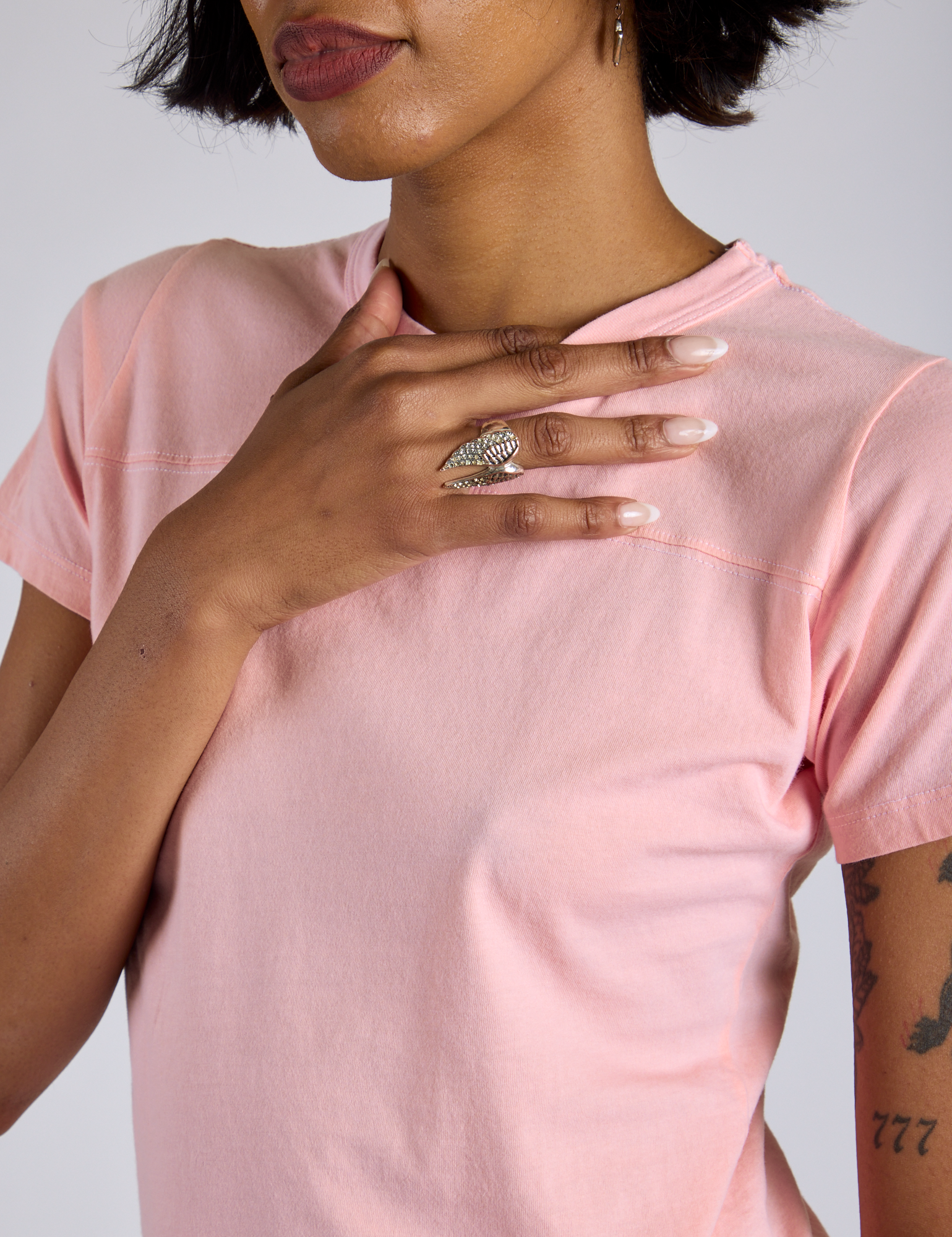 Jr. Varsity Tee in Baby Pink close up on Kira
