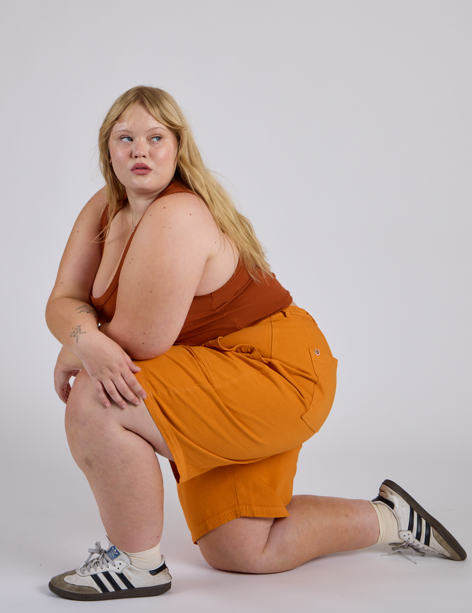 Longline Work Shorts in Creamsicle Orange and burnt terracotta Cropped Tank worn by Juliet