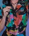 Short Sleeve Jumpsuit in Rainbow Magic Waters front close up on Alex