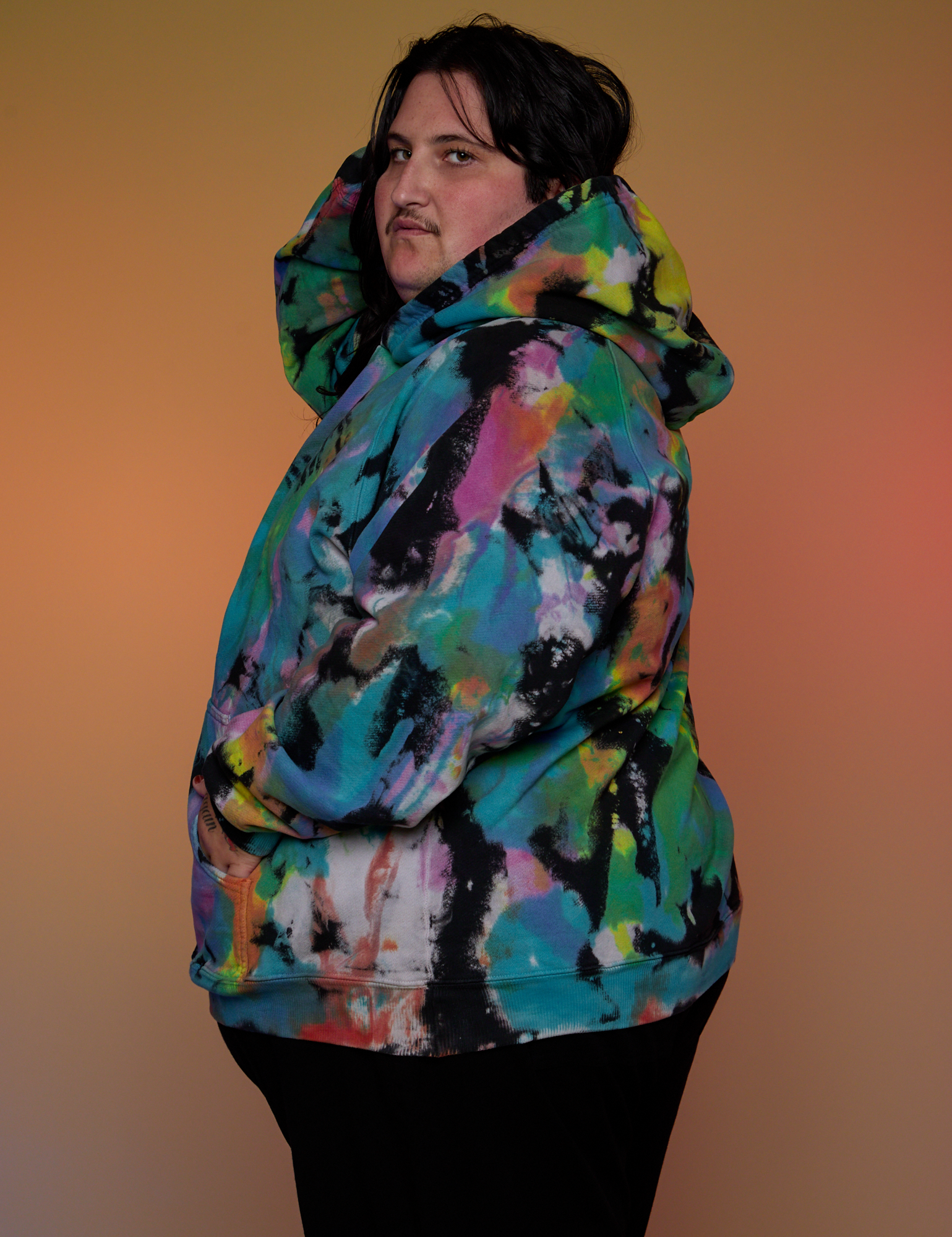 Oversized Hoodie in Rainbow Magic Waters side view on Sam