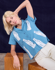 Madeline is wearing Soda Bottle Pantry Button-Up in Greek Blue