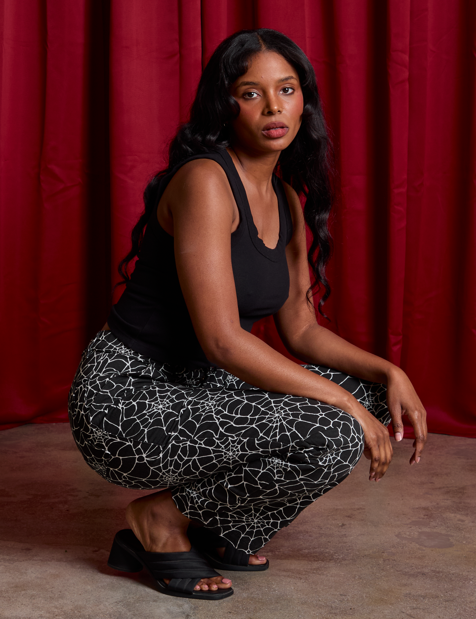 Kandia is wearing Work Pants in Spiderwebs and black Cropped Tank