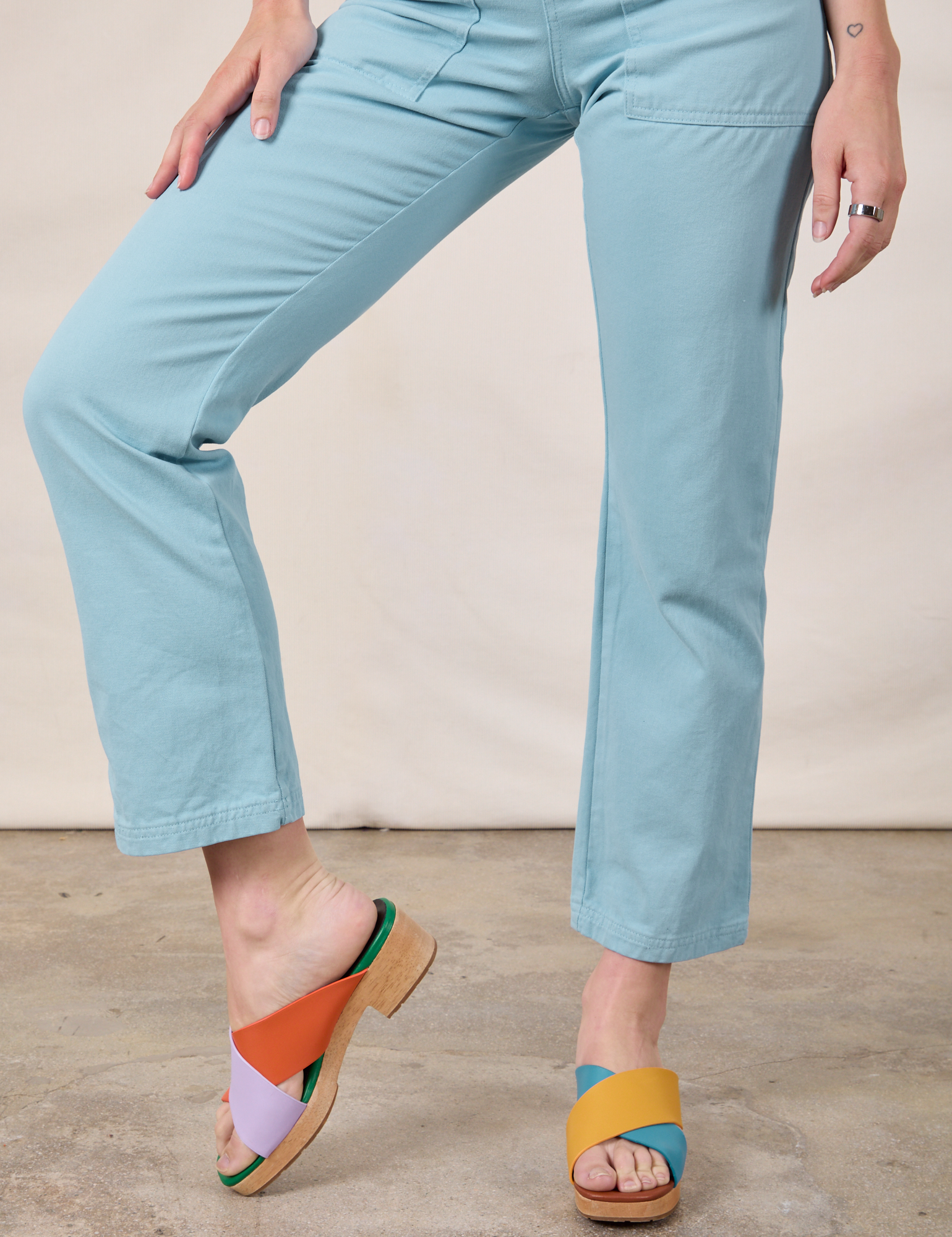 Short Sleeve Jumpsuit in Baby Blue pant leg close up on Alex