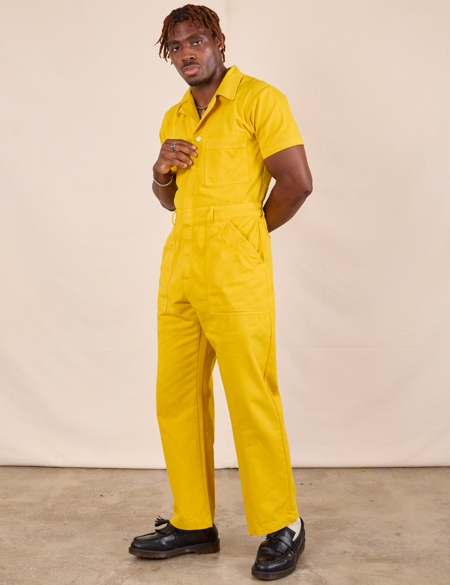 Short Sleeve Jumpsuit in Golden Yellow front angled view on Issac