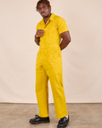 Short Sleeve Jumpsuit in Golden Yellow front angled view on Issac