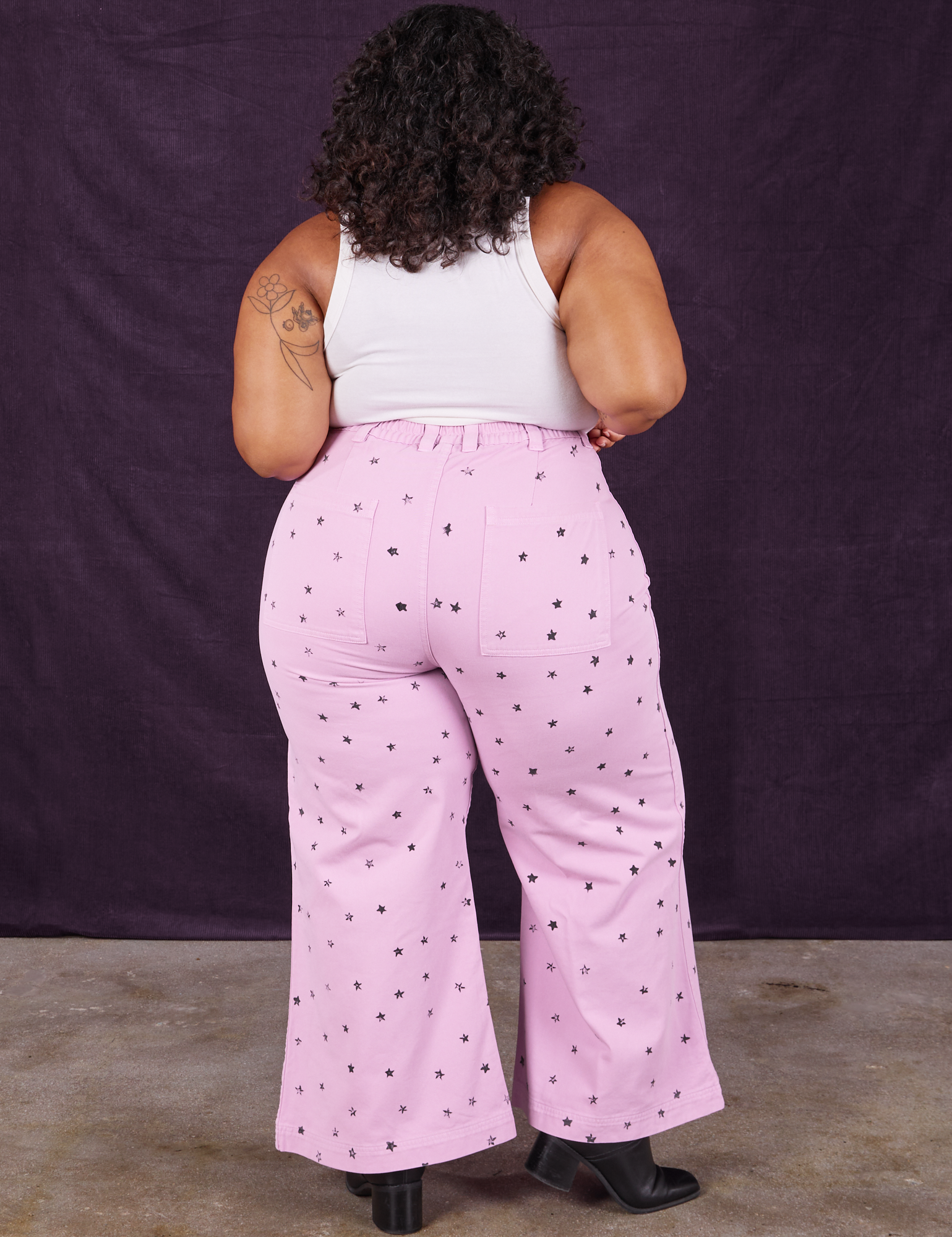 Back view of Star Bell Bottoms in Lilac Purple and Cropped Tank in vintage tee off-white on Morgan