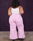 Back view of Star Bell Bottoms in Lilac Purple and Cropped Tank in vintage tee off-white on Morgan