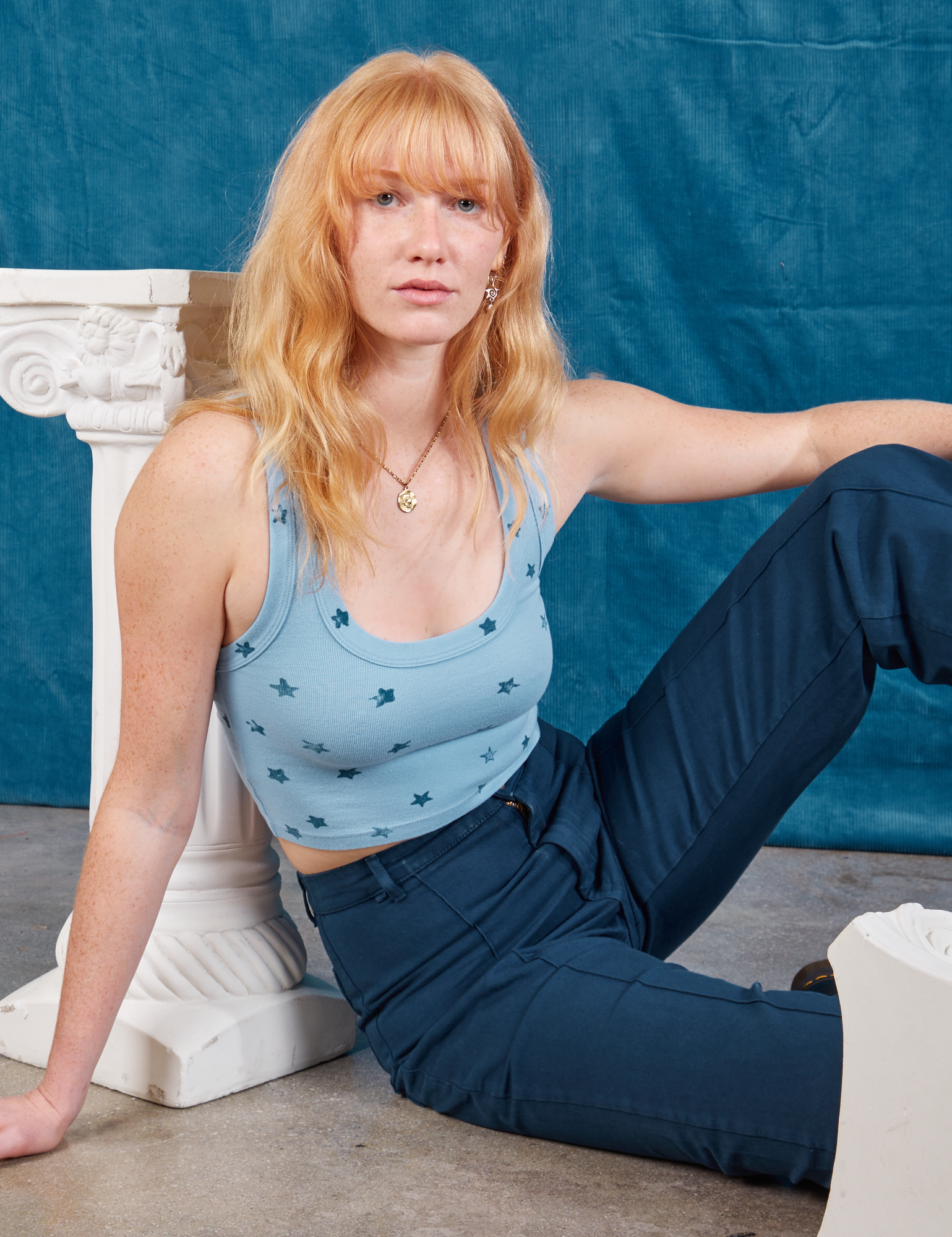 Margaret is wearing Star Cropped Tank and lagoon Western Pants