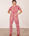 Tiara is 5'4" and wearing XS Cherry Stripe Jumpsuit