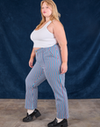 Side view of Stripe Work Pants in Blue Raspberry and Cropped Tank in vintage tee off-white on Juliet