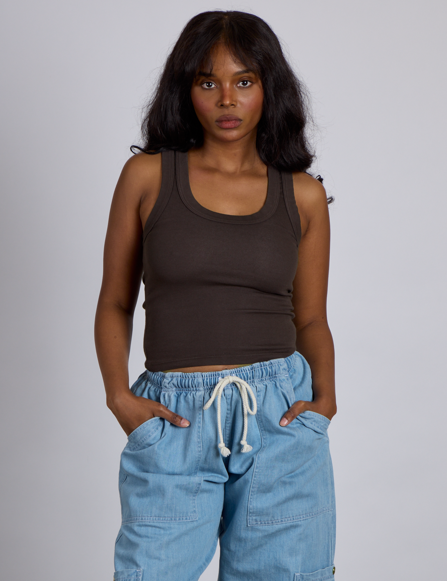 Kandia is 5’4” and wearing P The Tank Top in Espresso Brown