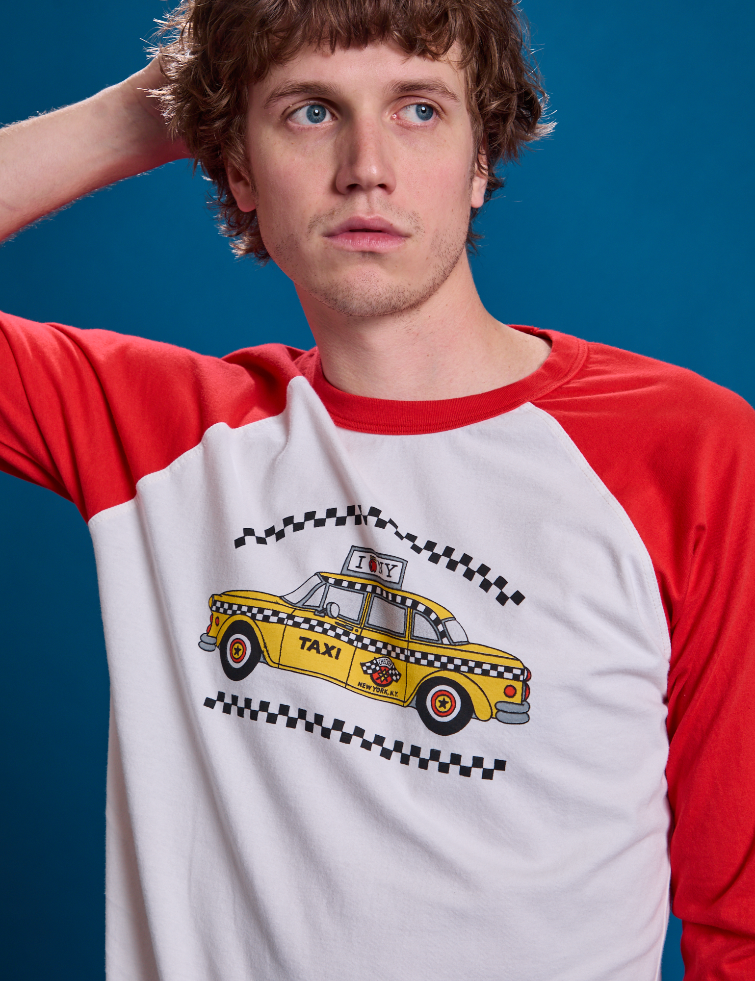 Taxi Raglan Tee in NYC front close up on Quinn