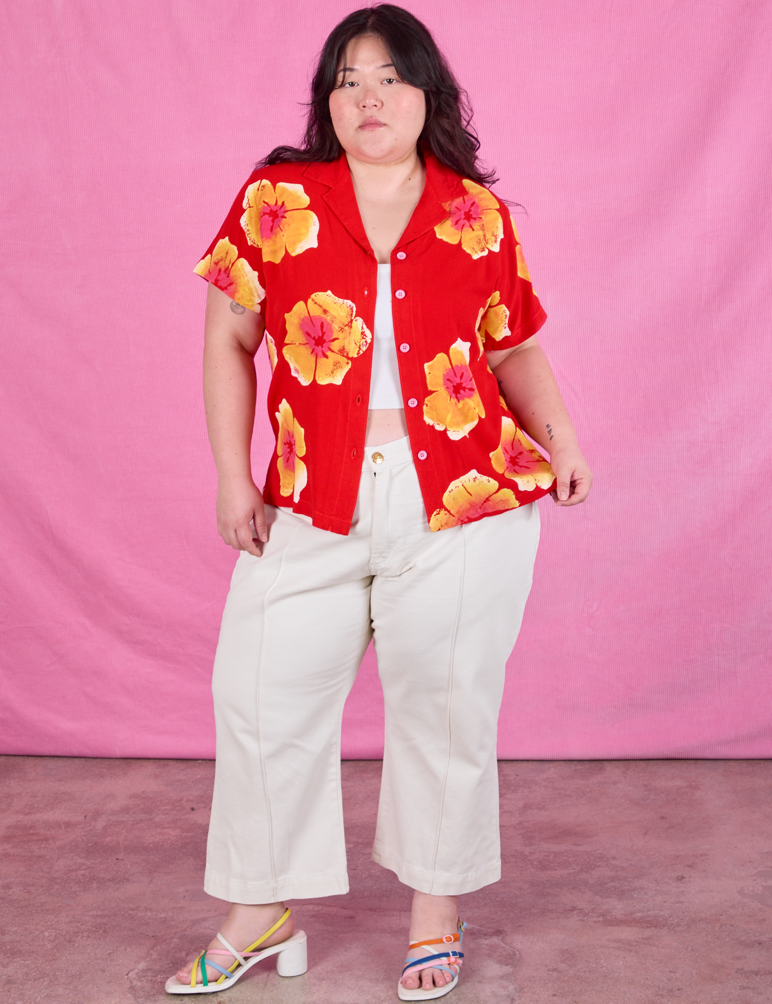 Ashley is wearing Paintstamped Pantry Button-Up in Mustang Red paired with vintage tee off-white Western Pants