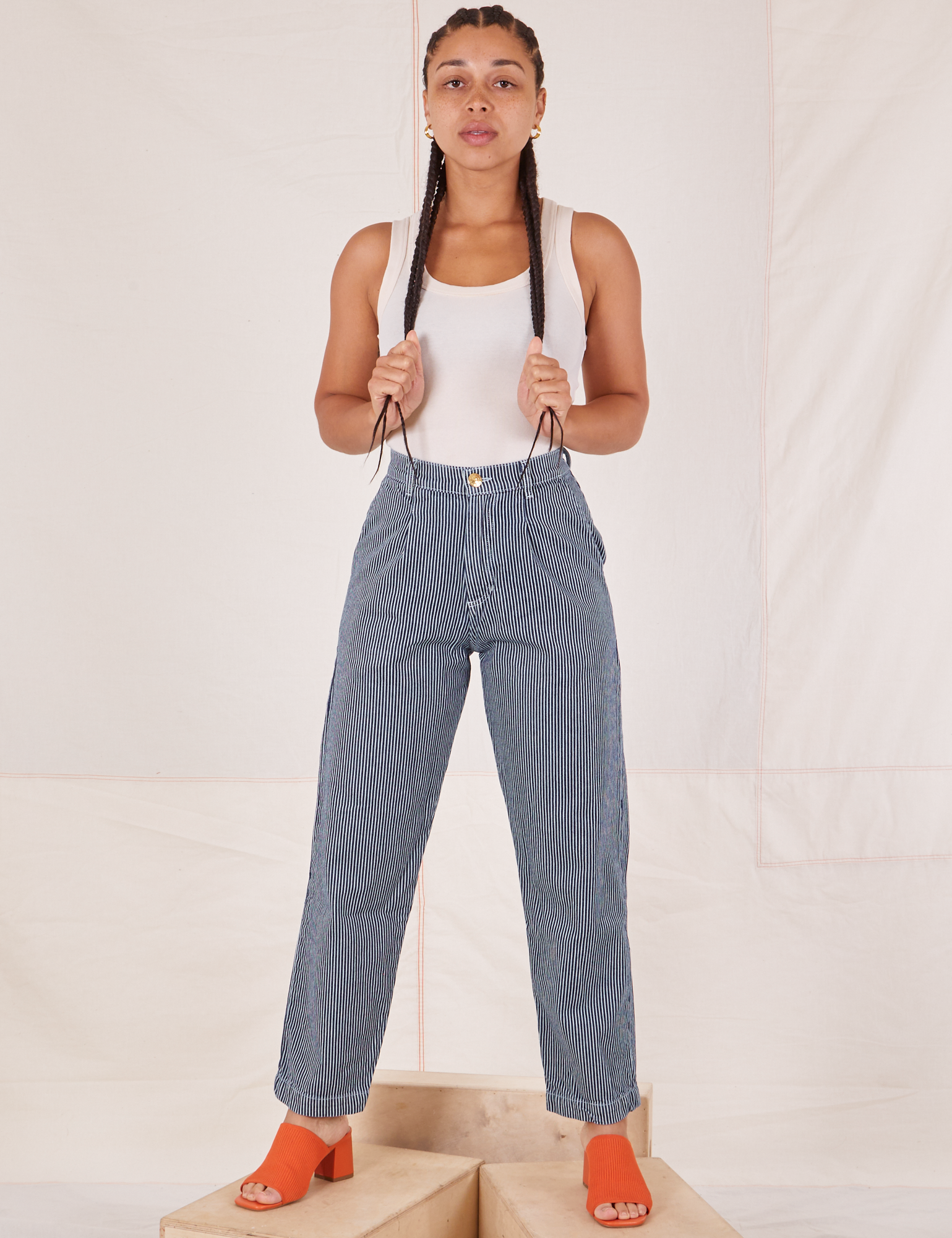 Gabi is 5&#39;7&quot; and wearing XXS Denim Trouser Jeans in Railroad Stripe paired with a vintage off-white Tank Top