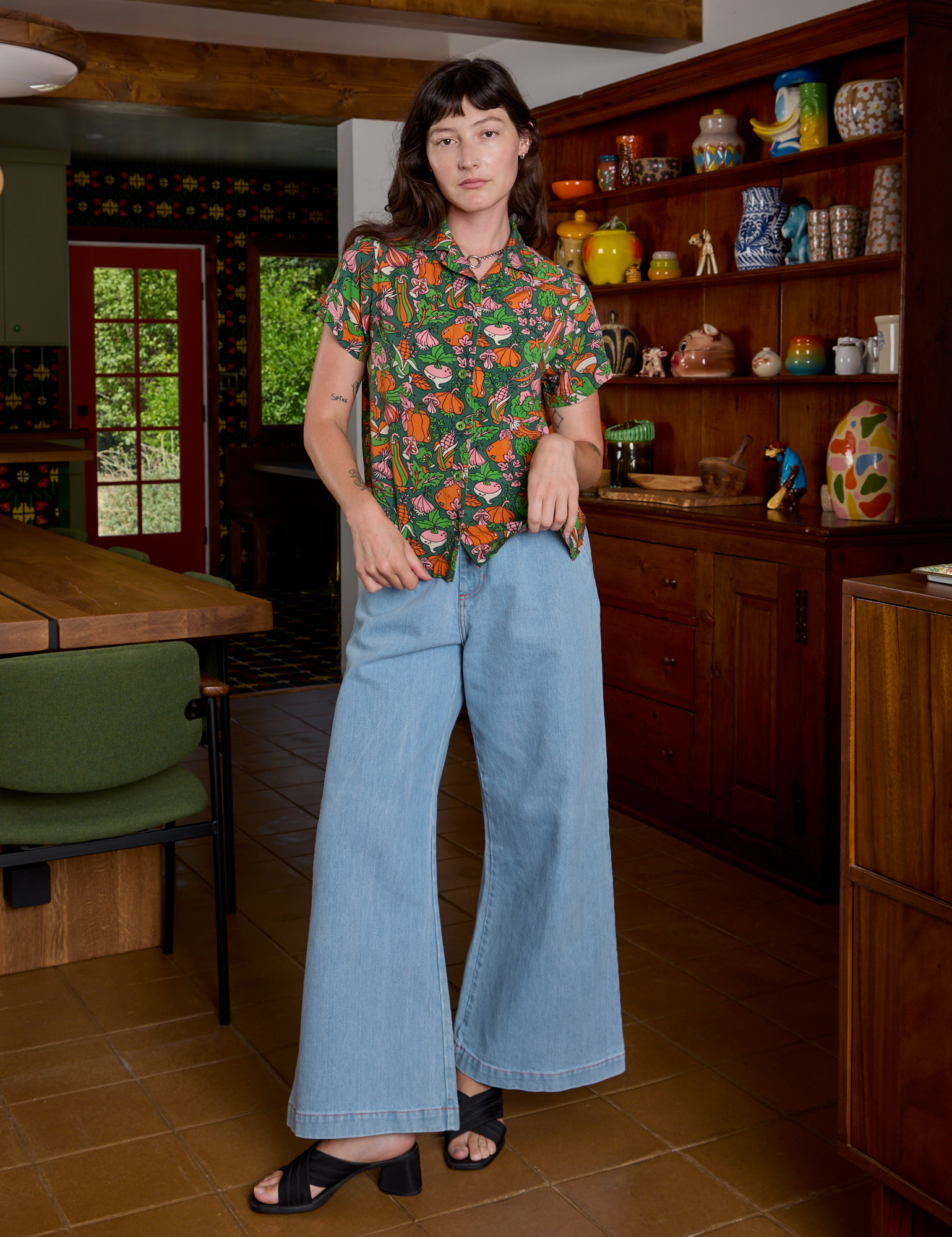 Alex is wearing Kitchen Collection Pantry Button-Up and light wash Indigo Wide Leg Trousers