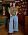 Alex is wearing Kitchen Collection Pantry Button-Up and light wash Indigo Wide Leg Trousers