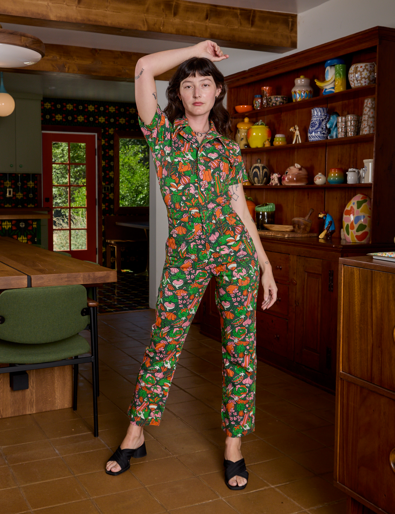 Alex is is 5&#39;8&quot; and wearing XXS Short Sleeve Jumpsuit in Kitchen Collection