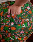 Close up of Juliet's hand in the back pocket of Work Pants in Kitchen Collection