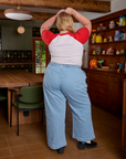 Back view of Short Sleeve Raglan Tee in Tomatoes and light wash Indigo Wide Leg Trousers on Juliet