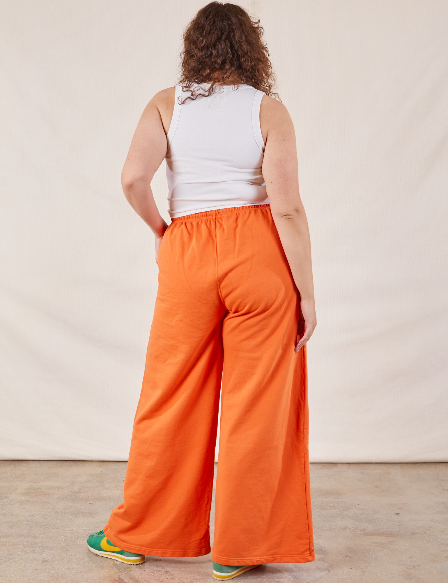 Wide Leg Sweat Pants in Sunset Orange back view on Ryan