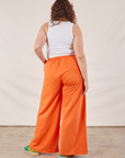 Wide Leg Sweat Pants in Sunset Orange back view on Ryan